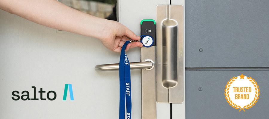 Hand using fob with SALTO door handle